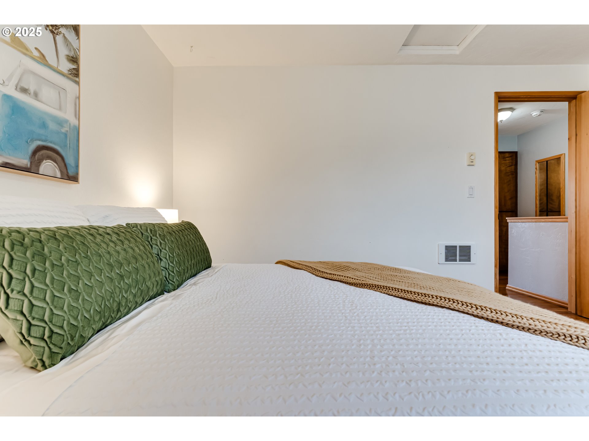 1555 Fetters Loop Eugene, OR 97402 - Photo 18 of 25 a bedroom with a bed and a night stand