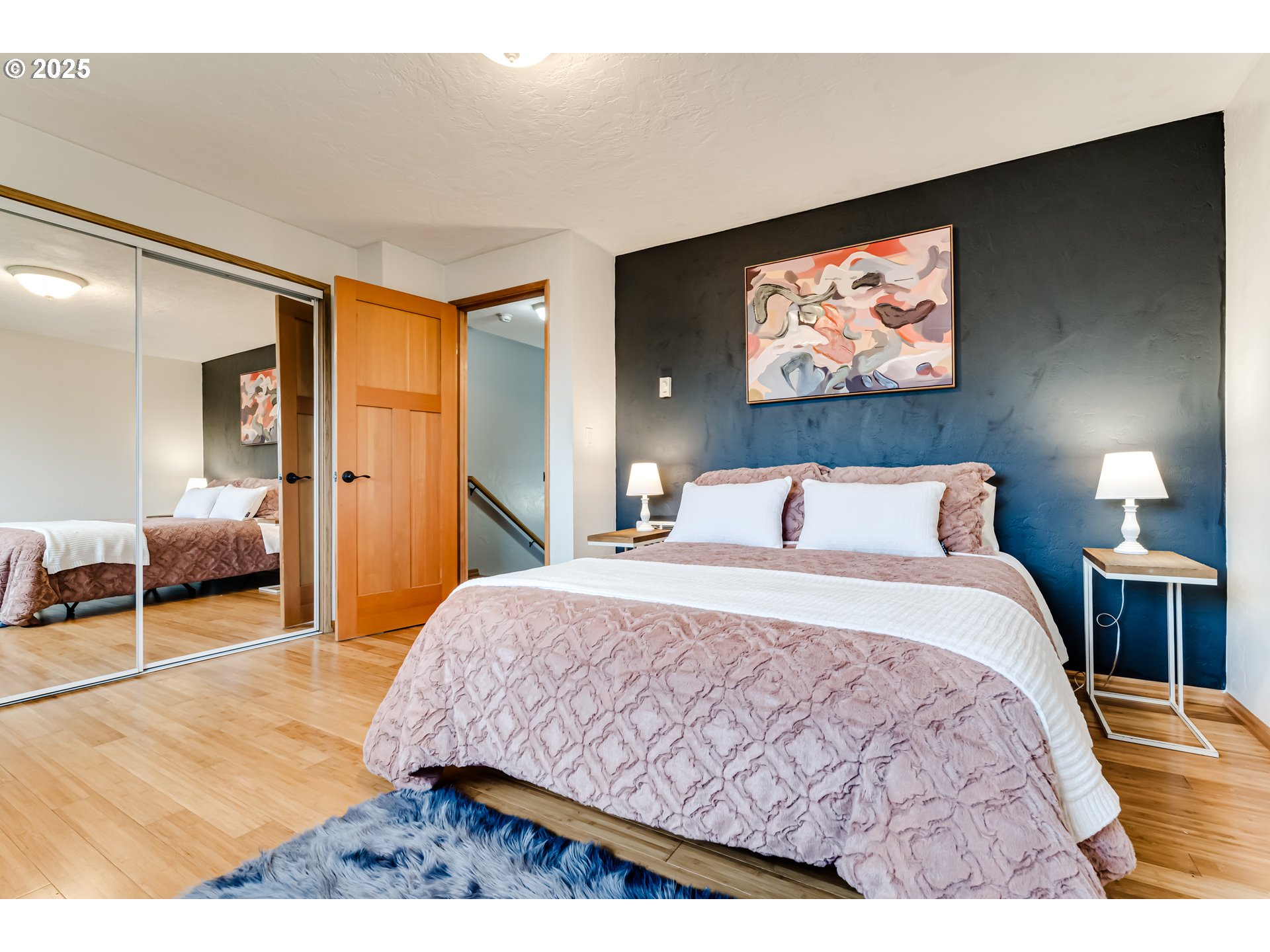 1555 Fetters Loop Eugene, OR 97402 - Photo 21 of 25 a bedroom with a bed and a view of bathroom