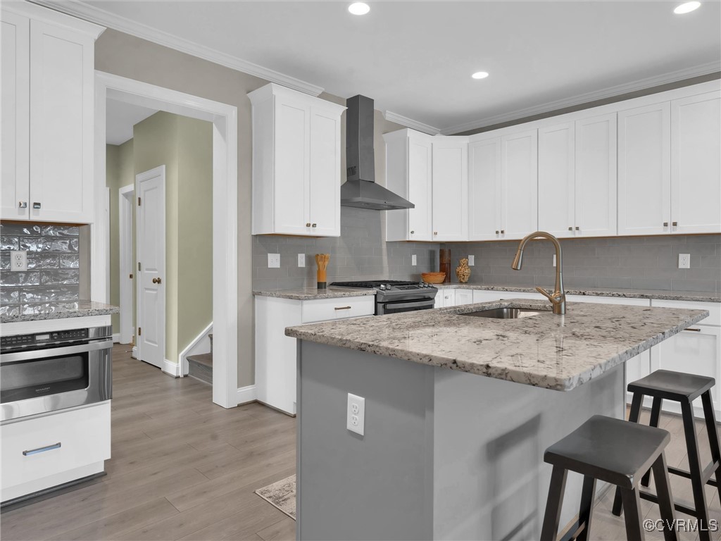 222 Lauradell Road Ashland, VA 23005 - Photo 23 of 42 Kitchen with wall chimney range hood, sink, decora