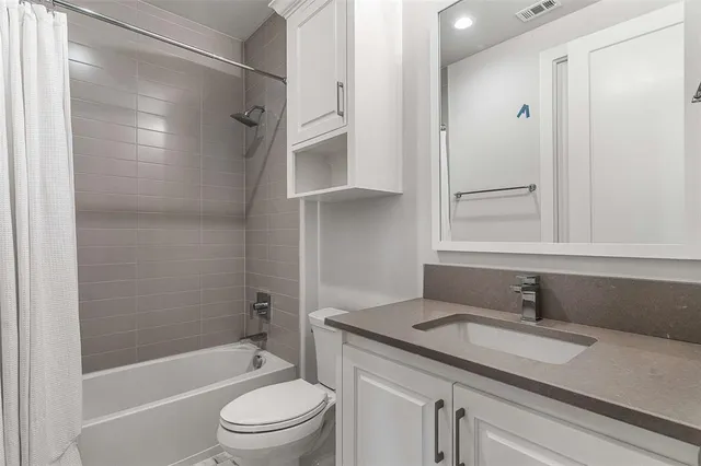 a view of city and mountain from a balcony