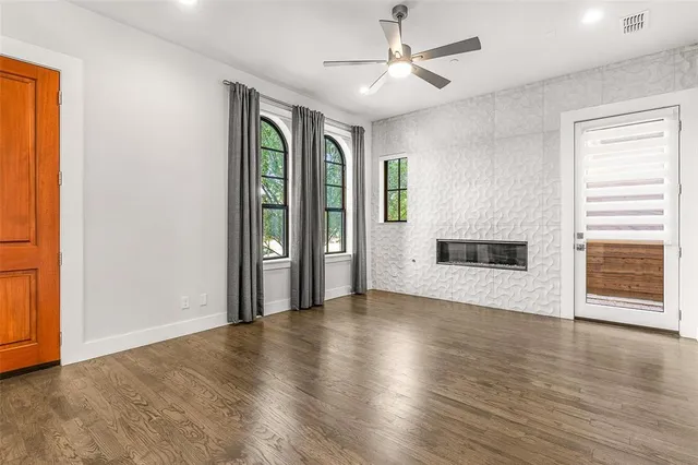 a spacious bathroom with a granite countertop sink and a large mirror