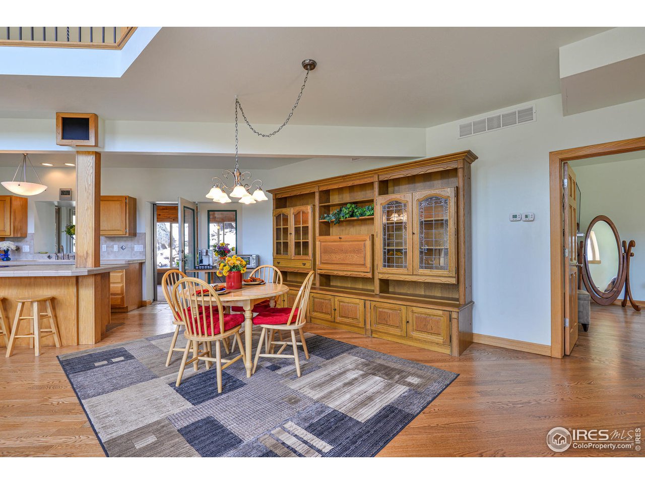 560 Stove Prairie Road Bellvue, CO 80512 - Photo 12 of 40 a view of a dining room with furniture and wooden floor