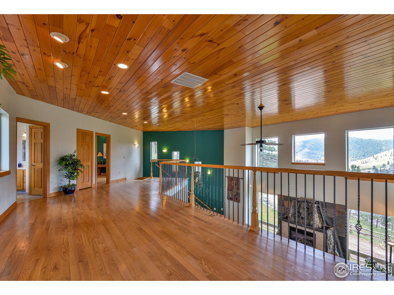 560 Stove Prairie Road Bellvue, CO 80512 - Photo 26 of 40 a view of livingroom with furniture and wooden floor