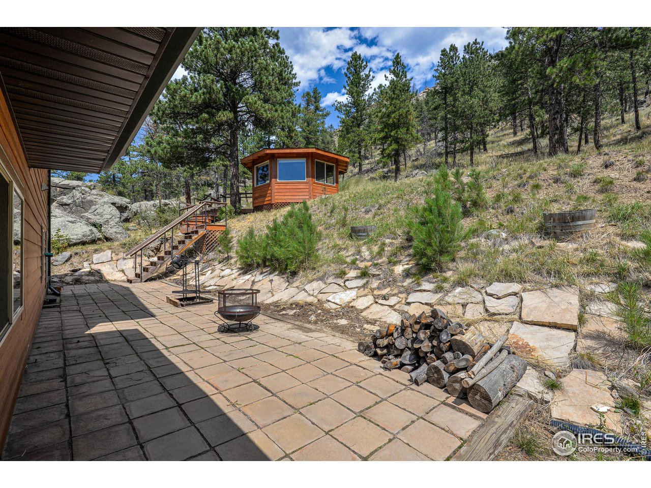 560 Stove Prairie Road Bellvue, CO 80512 - Photo 28 of 40 a view of outdoor space stove and sitting space