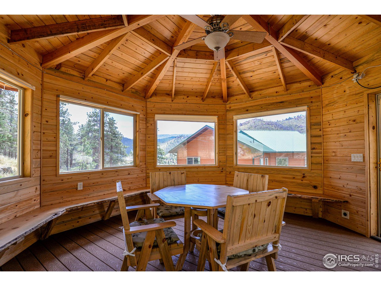 560 Stove Prairie Road Bellvue, CO 80512 - Photo 33 of 40 a dining room with furniture and a window