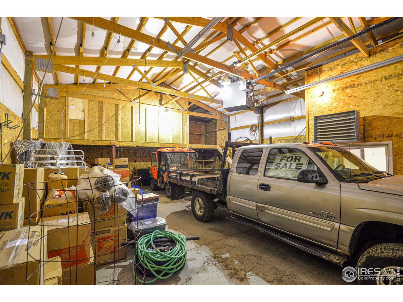 560 Stove Prairie Road Bellvue, CO 80512 - Photo 36 of 40 a utility room with lots of cars parked