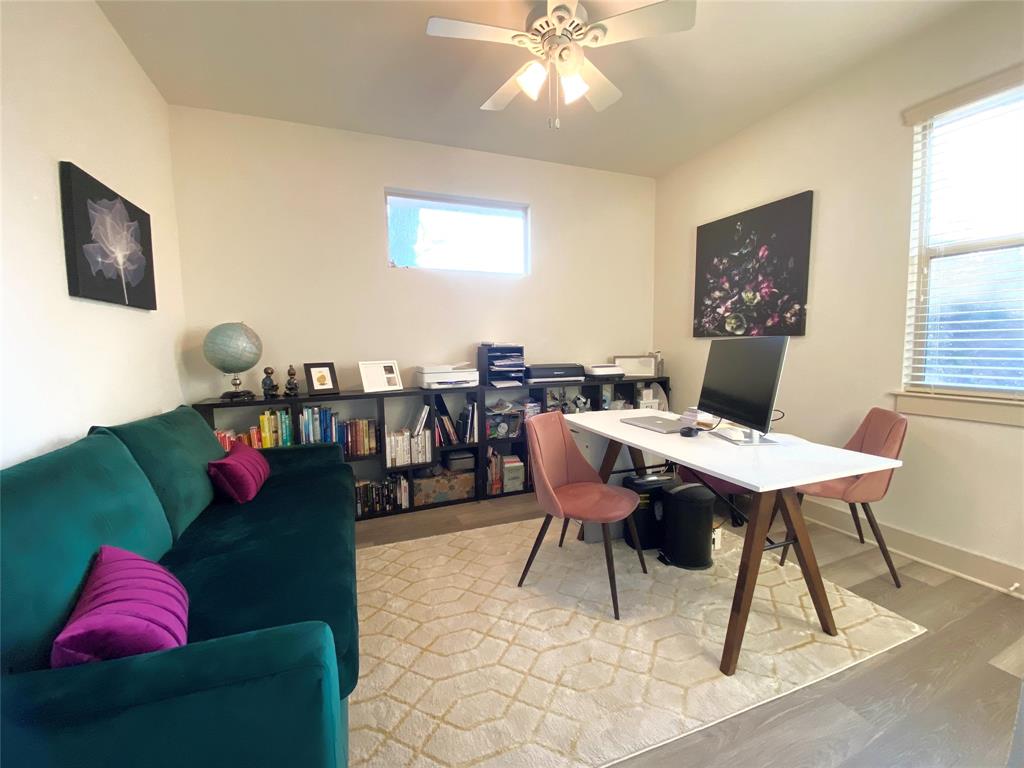 604 Allen Street, Unit 104 Austin, TX 78702 - Photo 12 of 16 a view of a dining room with furniture and wooden floor