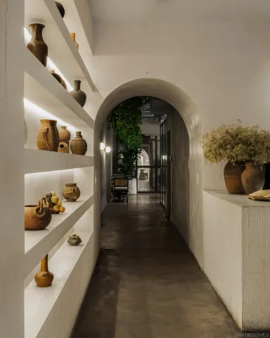 a view of entryway and hall with wooden floor