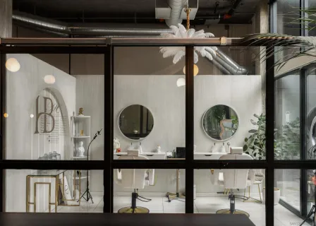 a living room with furniture flowerpot and a window