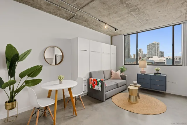 a kitchen with stainless steel appliances granite countertop a sink a stove and refrigerator