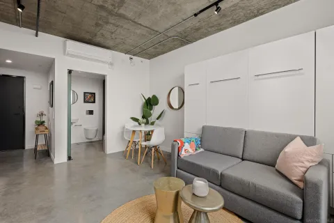 a bathroom with a toilet sink and shower