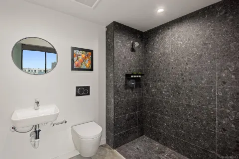 a open kitchen with stainless steel appliances granite countertop lots of counter top space a sink and furniture