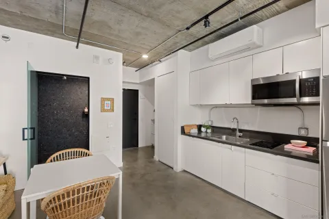 a view of a balcony with two chairs and a table