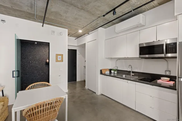 a view of a balcony with two chairs and a table