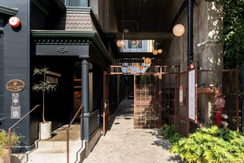 a view of a water fountain in front of retail shop
