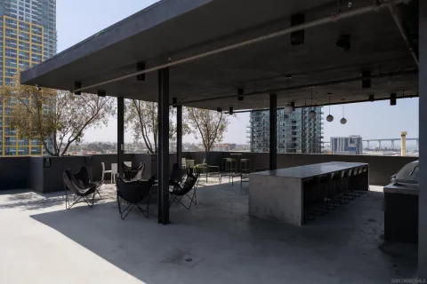 a view of a chairs and table in patio