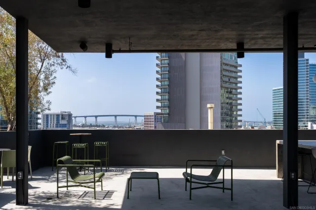 a kitchen with a table chairs and a wooden floor