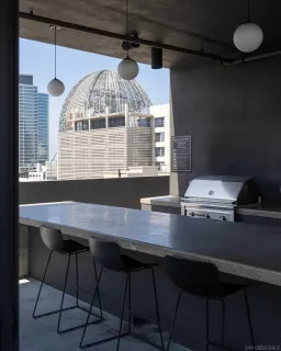 a view of a patio with table and chairs and potted plants