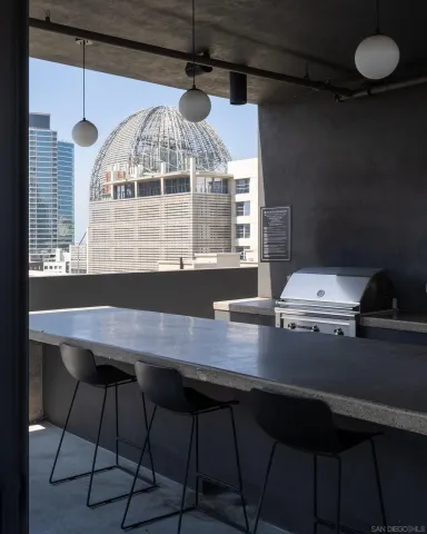 a view of a patio with table and chairs and potted plants