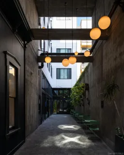 a view of a porch with chairs and potted plants