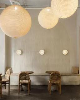 a living room with a table and chairs