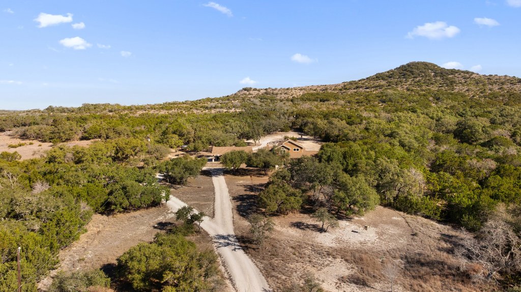 236 Ranch Cir Drive Kendalia, TX 78027 - Photo 1 of 1 Bird's eye view of a forest and mountains