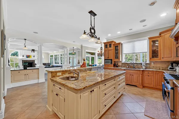 a kitchen with stainless steel appliances granite countertop a sink and cabinets