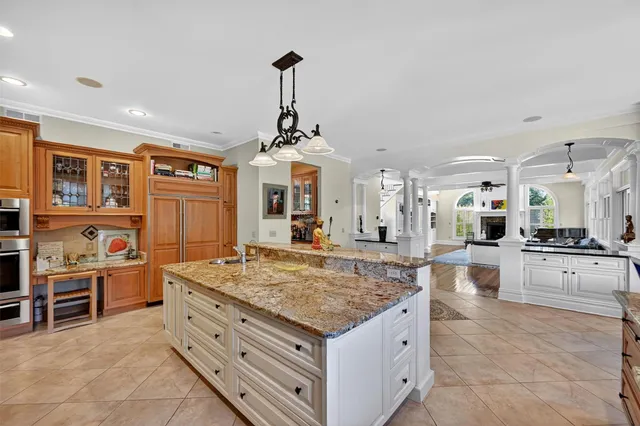 a kitchen with stainless steel appliances granite countertop a stove oven and a refrigerator