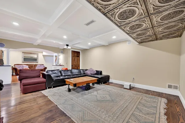 a bedroom with furniture and a rug