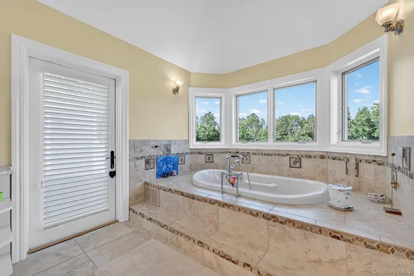 a kitchen with counter top space and windows