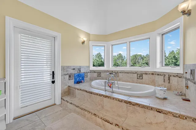 a kitchen with counter top space and windows