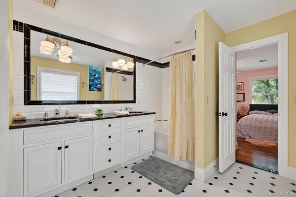 a bedroom with bed and a window