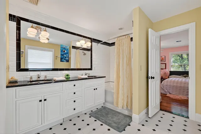 a bedroom with bed and a window