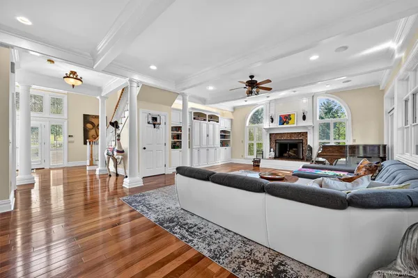 a living room with furniture and a fireplace