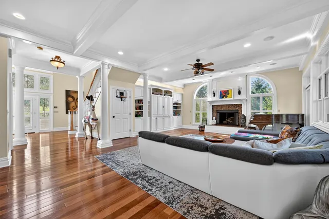 a living room with furniture and a fireplace
