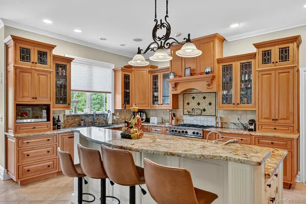 a kitchen with stainless steel appliances a sink and cabinets