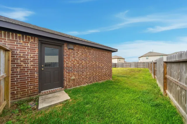 a backyard of a house with lots of green space