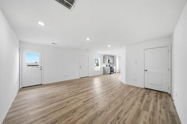a view of a livingroom with wooden floor