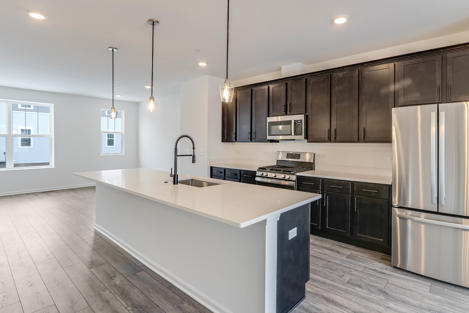 1552 Slade Way Des Plaines, IL 60018 - Photo 14 of 32 a kitchen with a sink a stove a refrigerator and cabinets