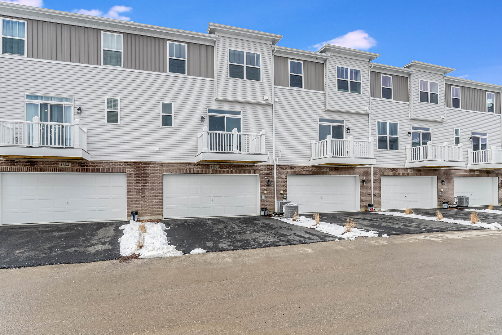 1552 Slade Way Des Plaines, IL 60018 - Photo 31 of 32 a front view of a building with a street