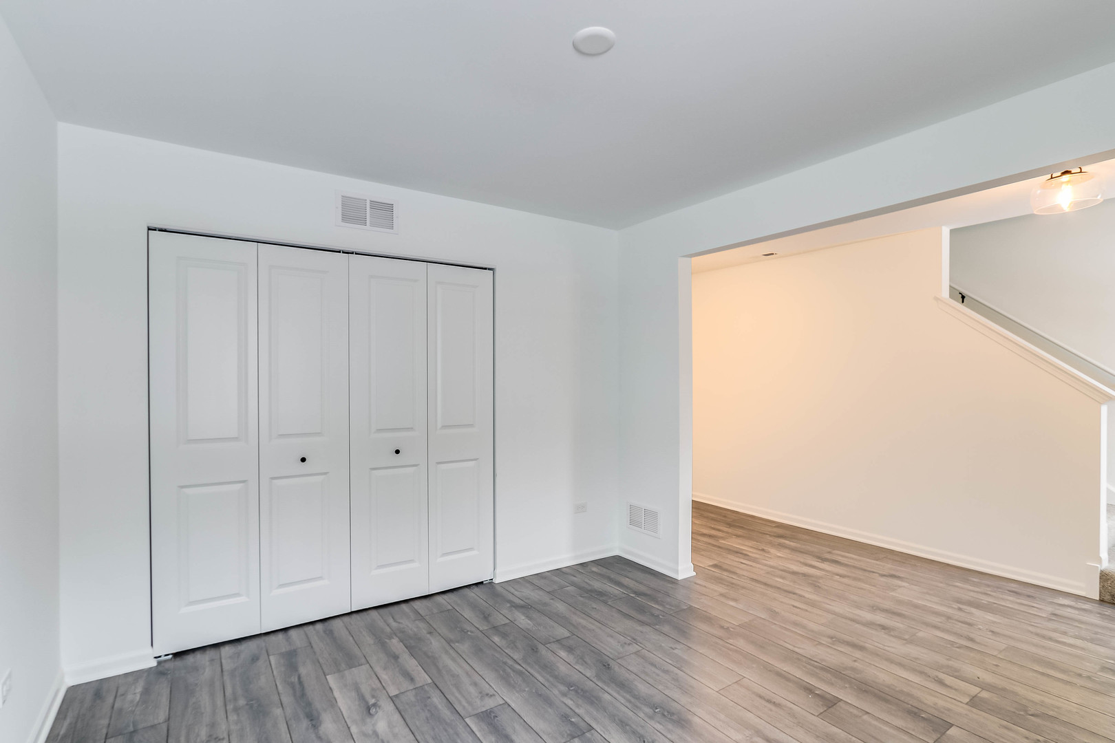 1552 Slade Way Des Plaines, IL 60018 - Photo 4 of 32 a view of an empty room with wooden floor