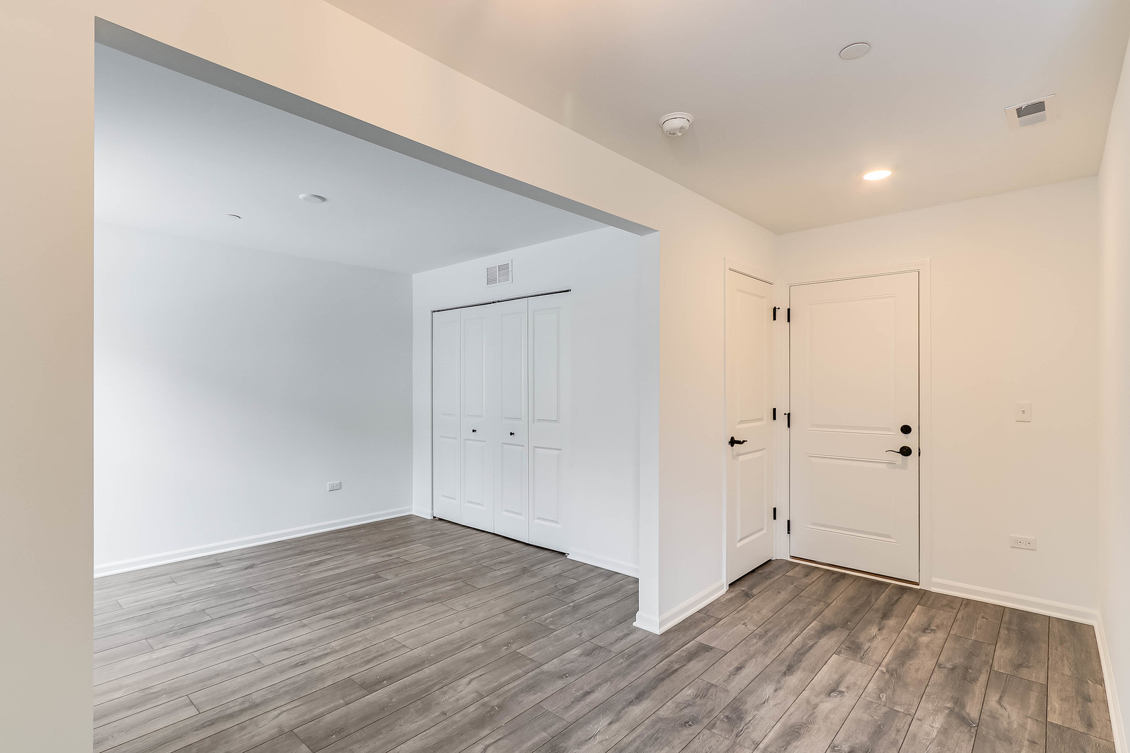 1552 Slade Way Des Plaines, IL 60018 - Photo 6 of 32 a view of an empty room with wooden floor