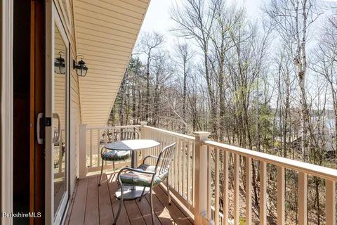a view of a balcony with chairs