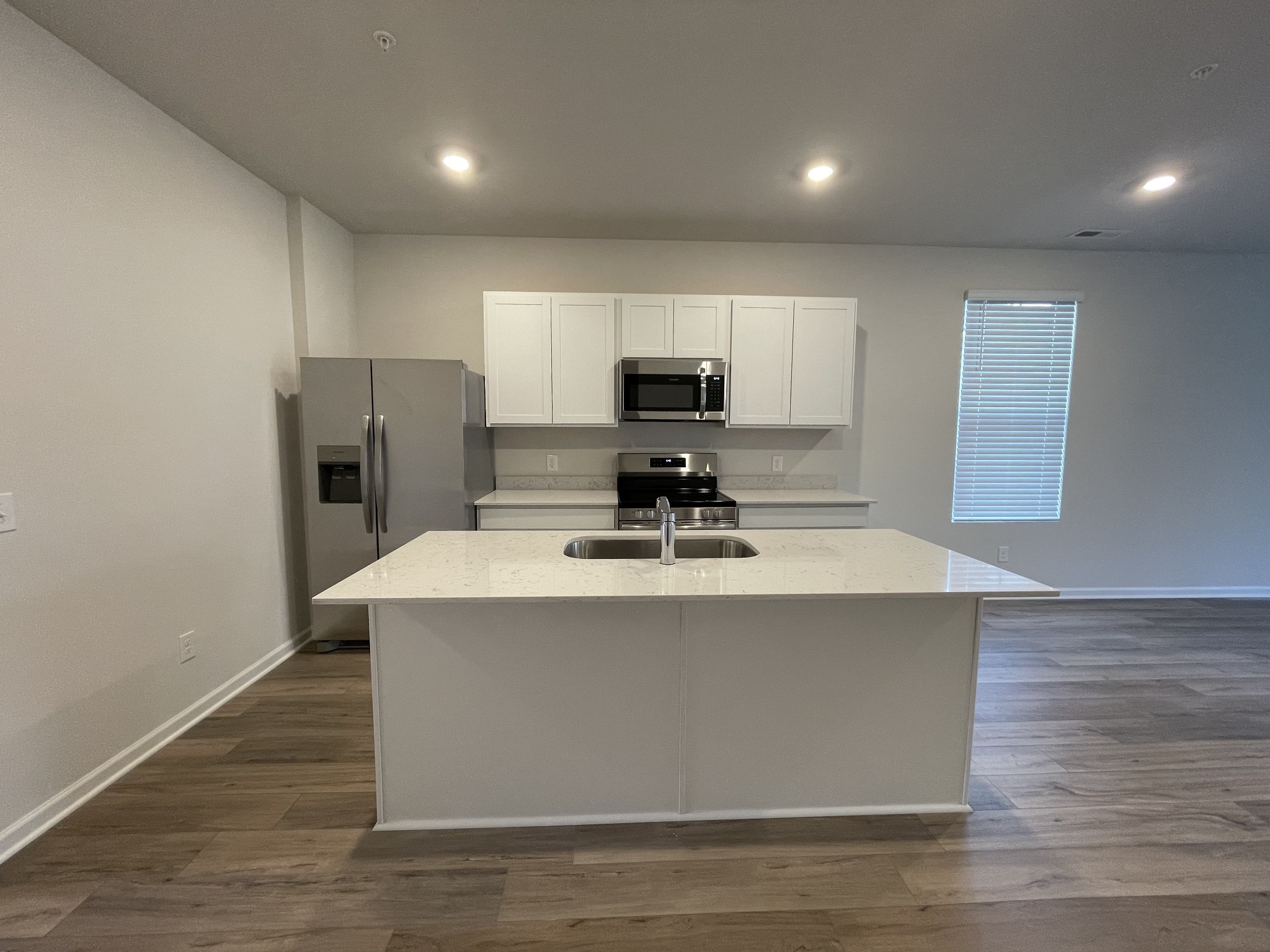 464 Alcott Way Spring Hill Spring Hill, TN 37174 - Photo 5 of 25 a view of kitchen with stainless steel appliances granite countertop a stove top oven a sink and a refrigerator