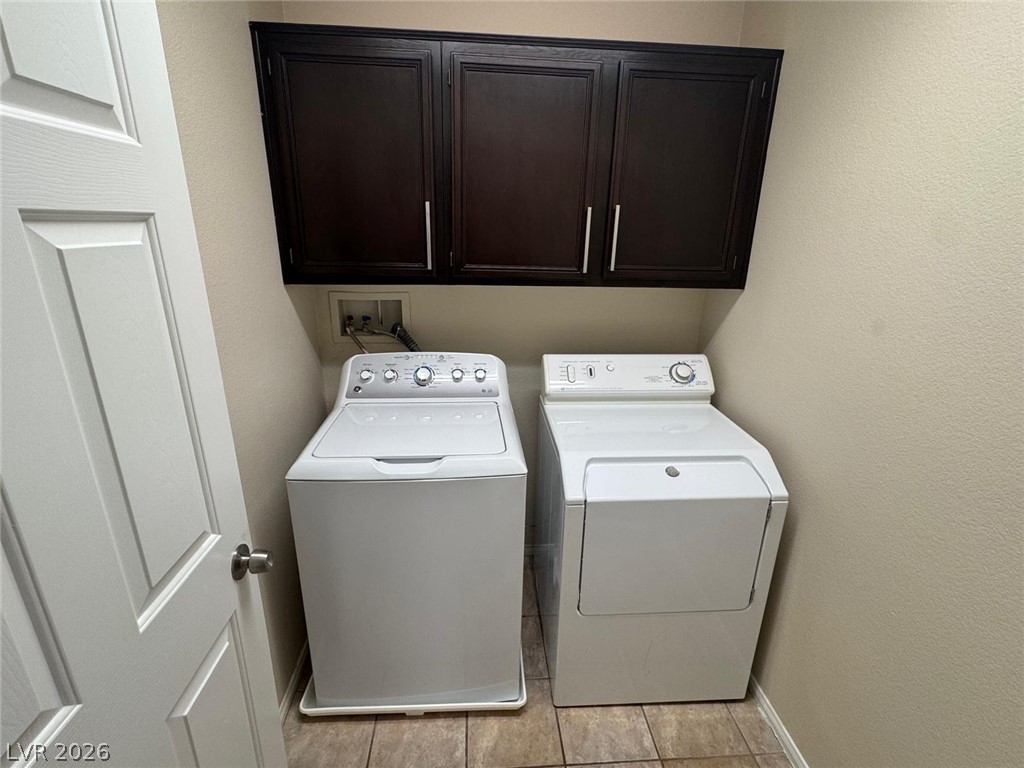 3962 Coyote Ridge Court Las Vegas, NV 89129 - Photo 29 of 35 Functional laundry space featuring modern appliances and convenient overhead cabinetry.