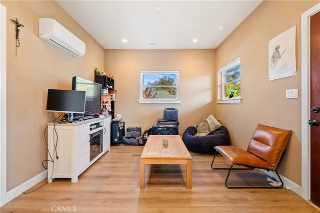 a kitchen with granite countertop white cabinets sink and white appliances