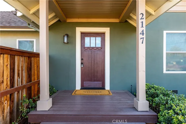 a white stove top oven sitting inside of a kitchen