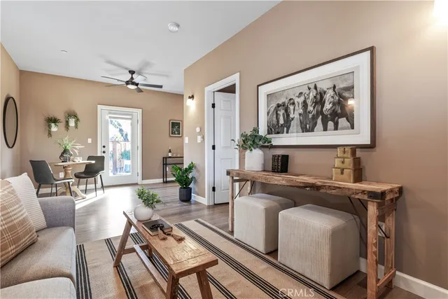 a dining room with furniture and mirror