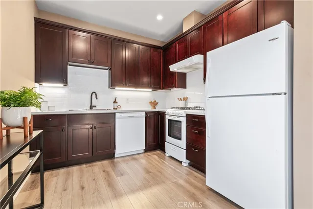 a view of a chairs and table on the wooden floor