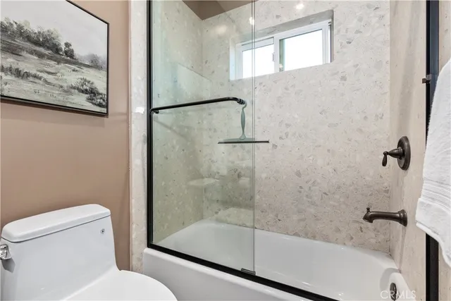 a view of entryway with livingroom and wooden floor